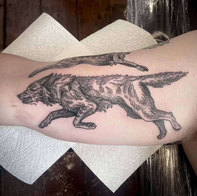 Running wolves black and grey arm tattoo for men