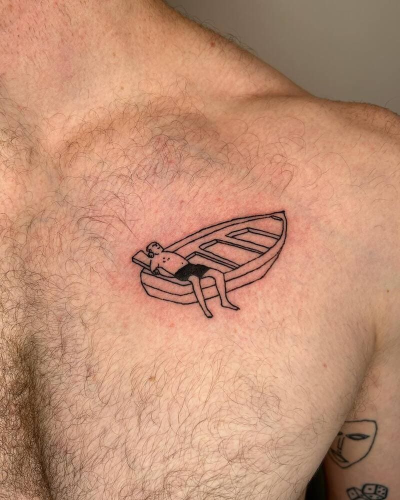small-minimalist-boat-figure-chest-tattoo-men