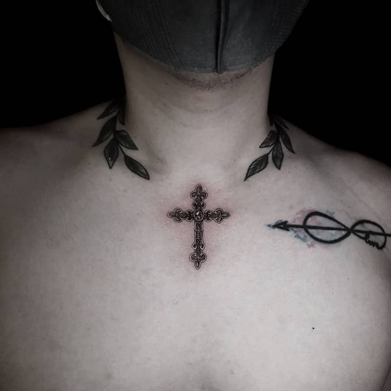 laurel-cross-small-chest-tattoo-men