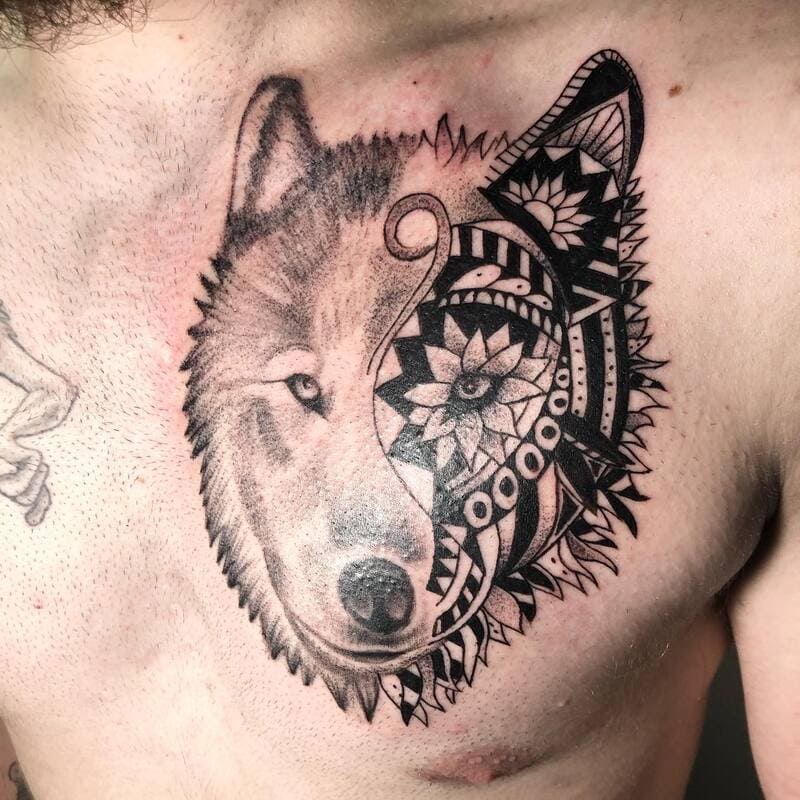 Split-design tribal and realistic wolf face tattoo for men