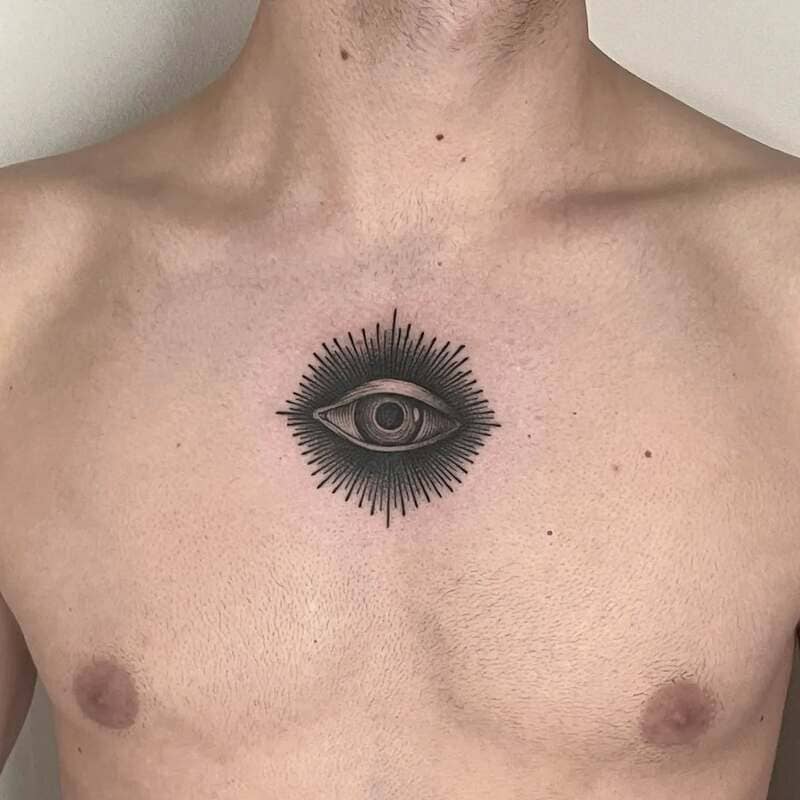 all-seeing-eye-small-center-chest-tattoo-men