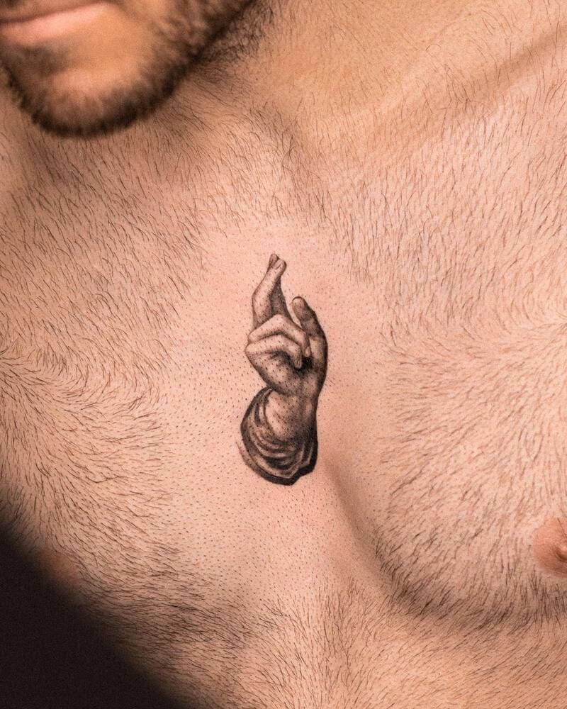 blessing-hand-small-religious-chest-tattoo-men