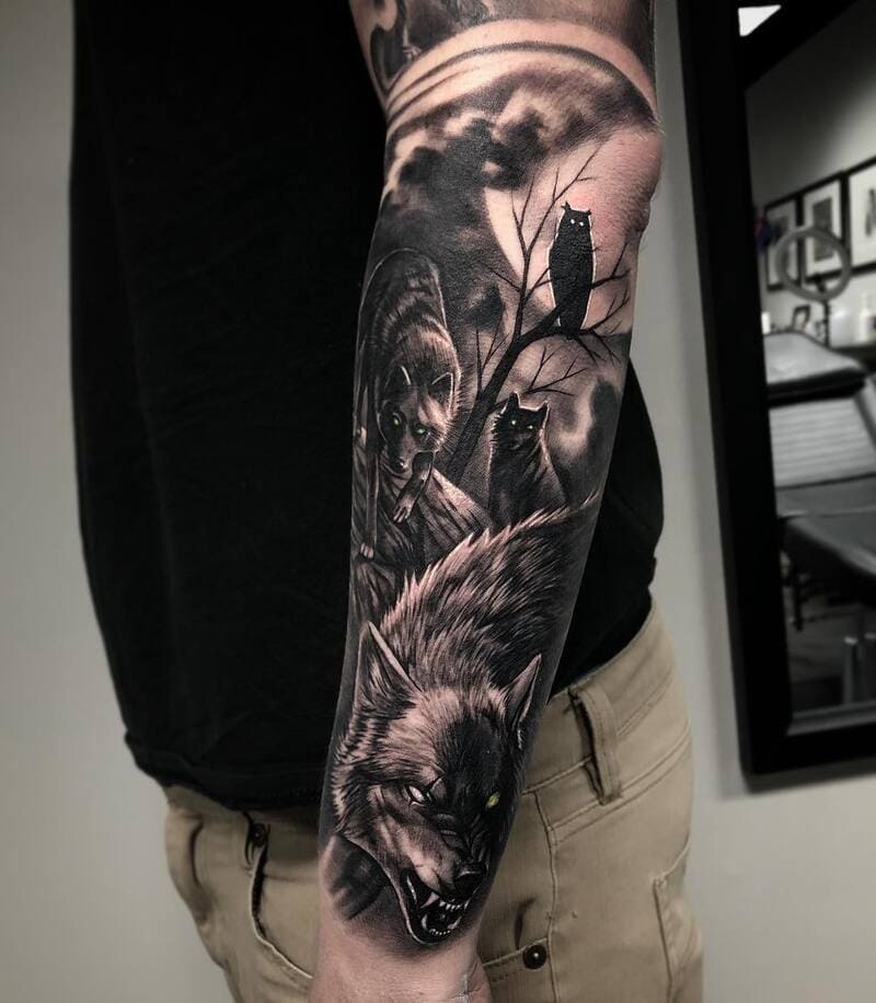 Dark wolf pack forest scene sleeve tattoo for men