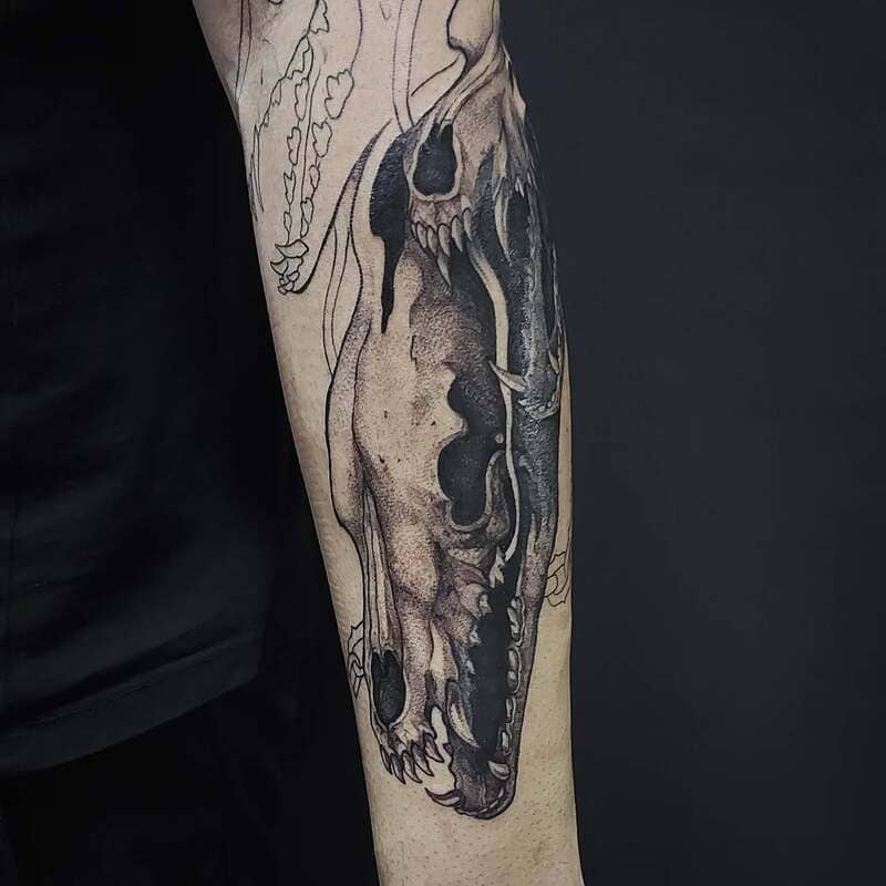 Realistic shaded wolf skull forearm tattoo for men