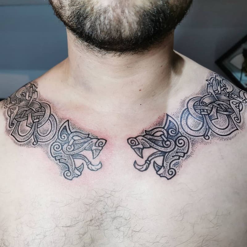 Celtic dual wolf design chest tattoo for men