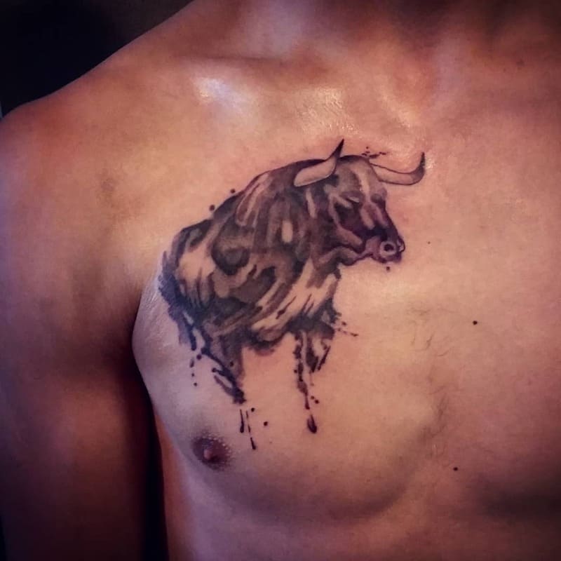 bull-watercolor-small-meaningful-chest-tattoo-men