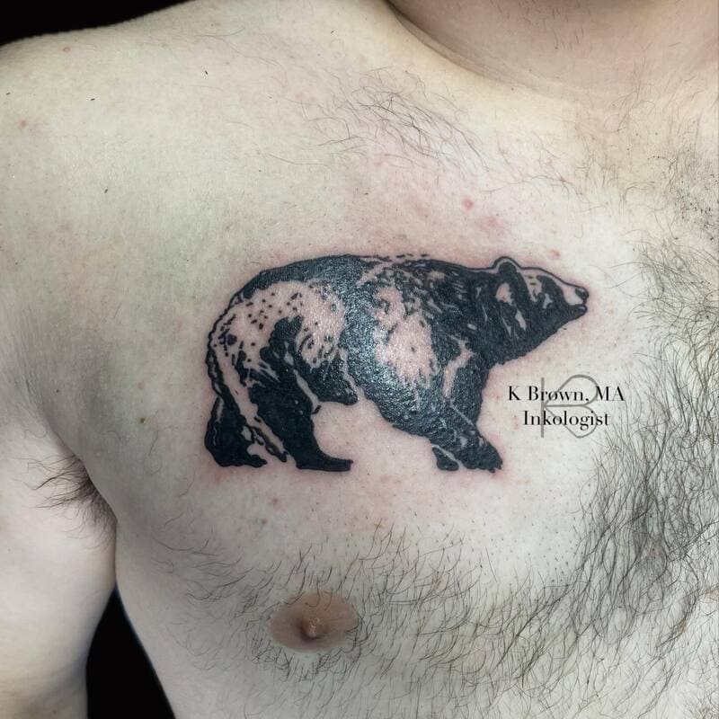 bear-silhouette-small-meaningful-chest-tattoo-men