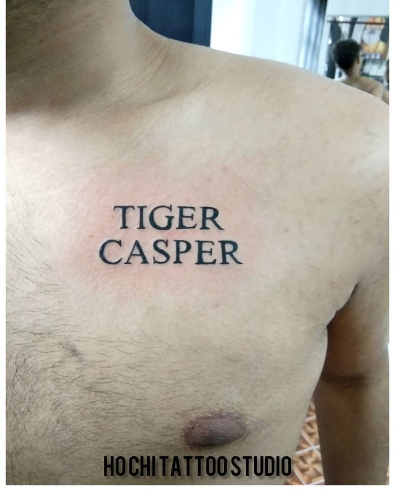 name-typography-small-chest-tattoo-men