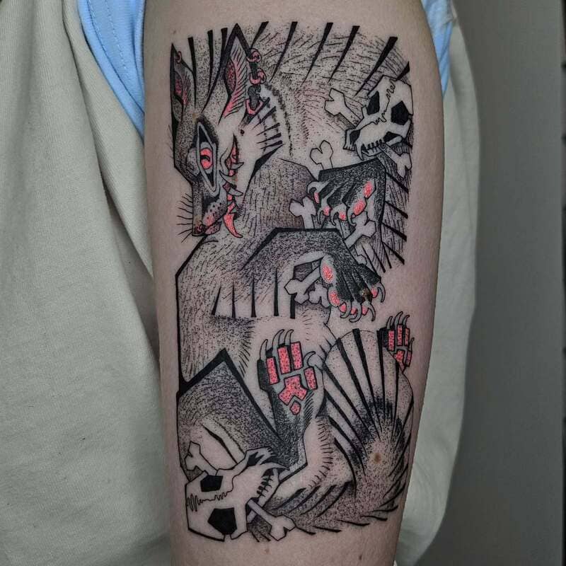 Dark fantasy wolf arm tattoo with skull elements and red accents for men