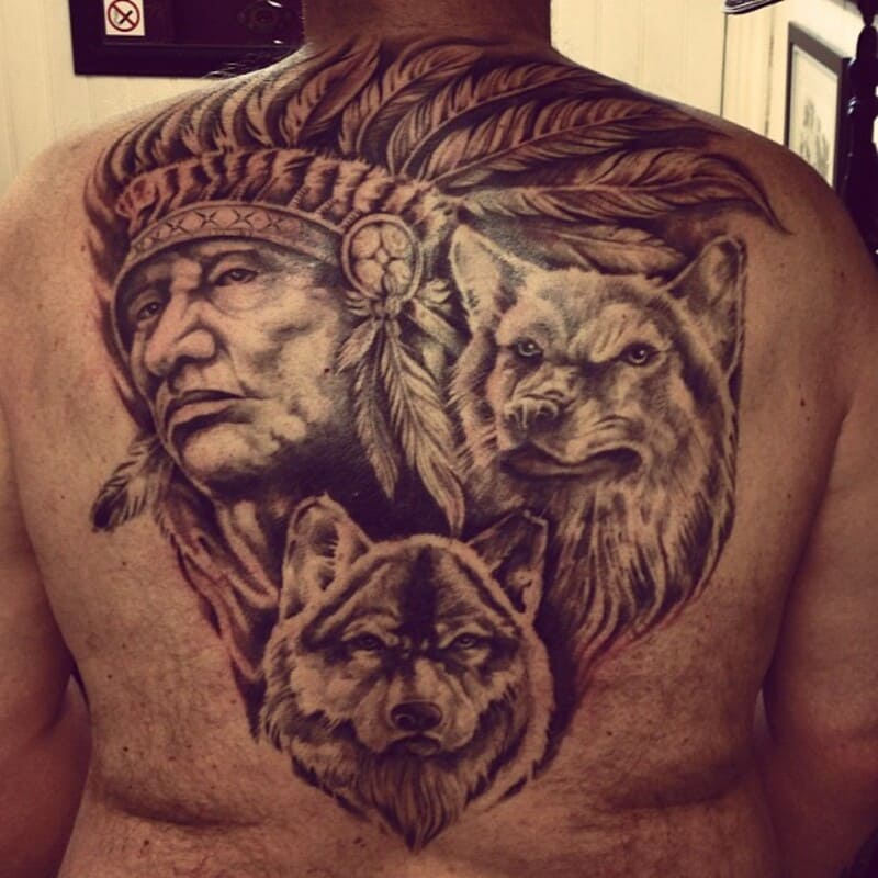 Native American chief with dual wolves back tattoo for men