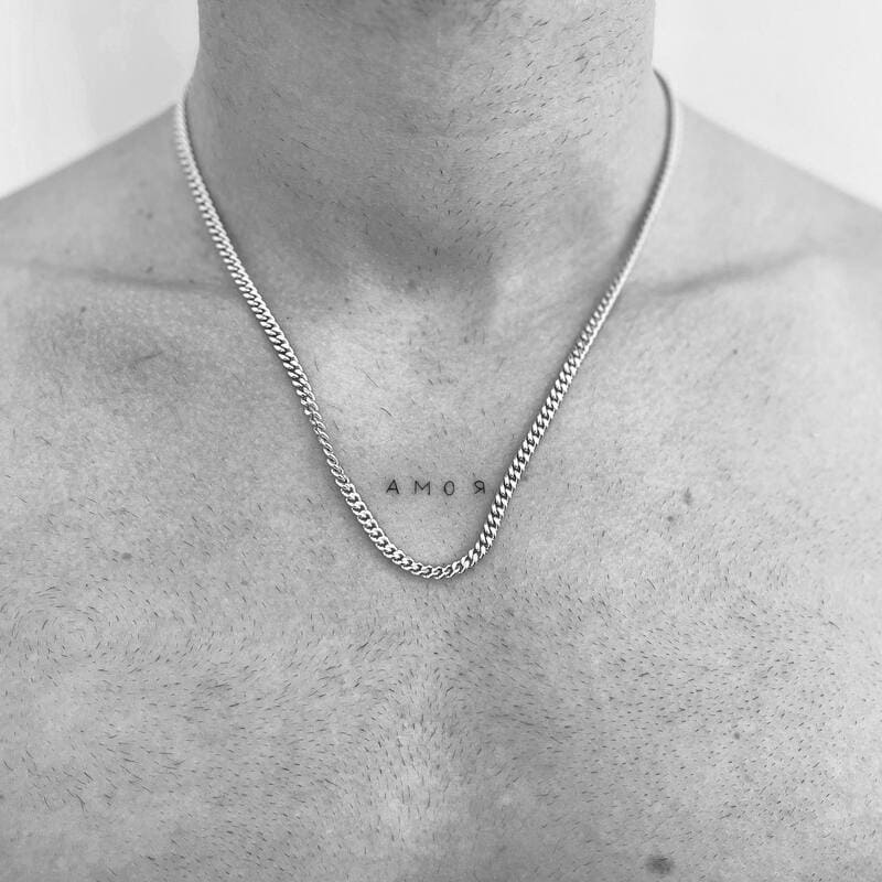 amor-minimal-small-chest-tattoo-men