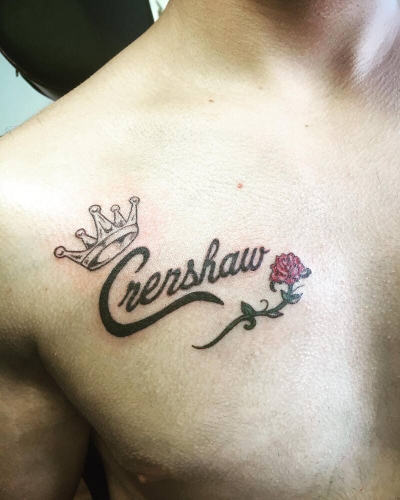 small-crown-name-script-chest-tattoo-men