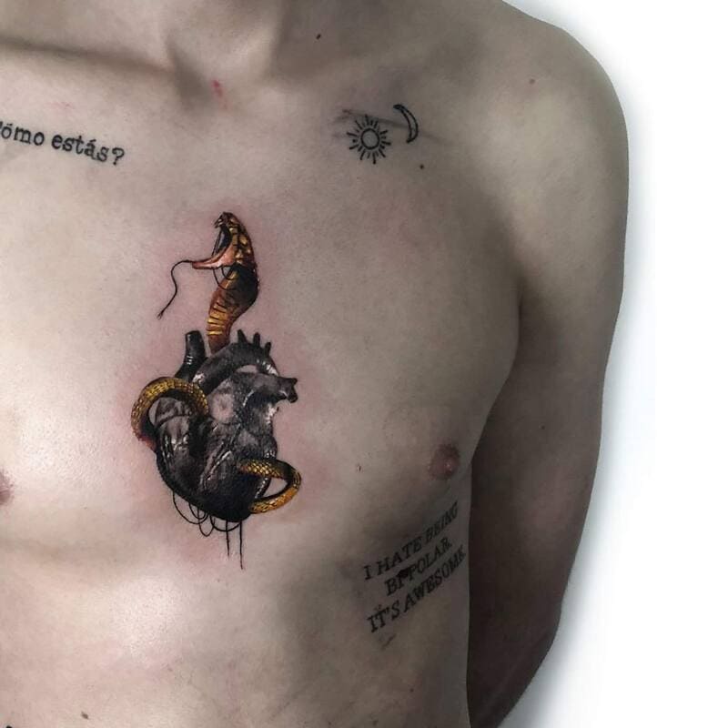 small-surreal-heart-snake-chest-tattoo-men