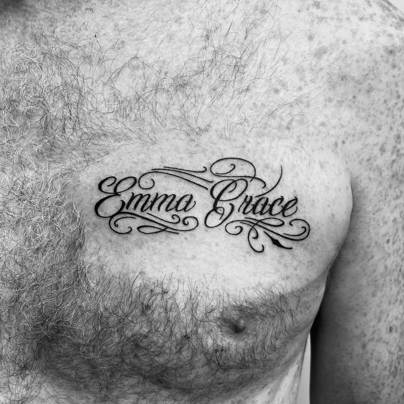 name-script-small-meaningful-chest-tattoo-men