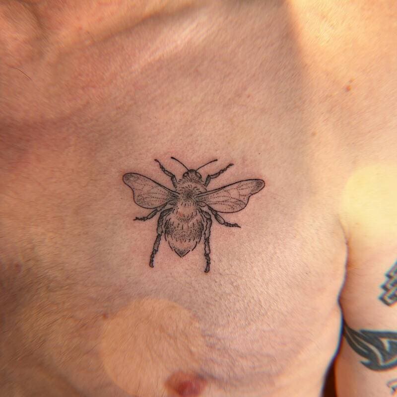 small-detailed-bee-chest-tattoo-men-nature