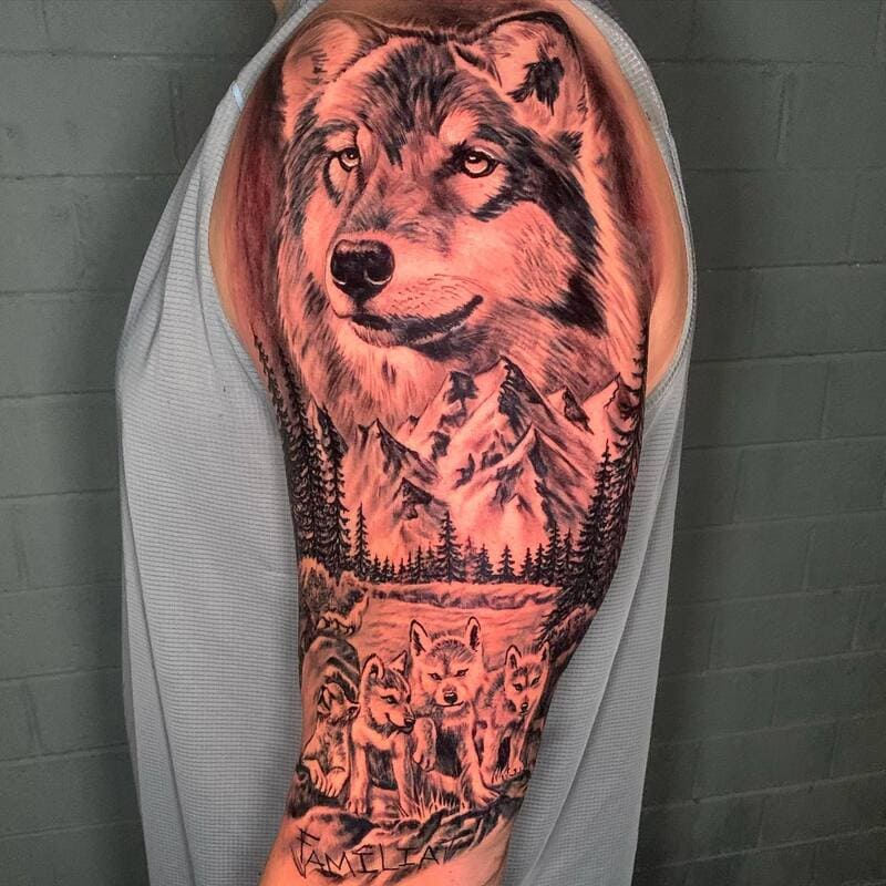 Mountain wolf pack half sleeve with alpha portrait for men