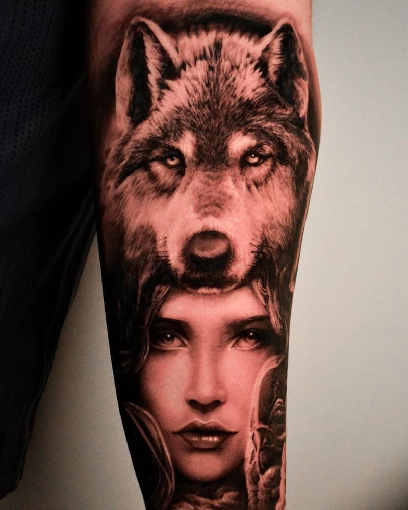 Realistic wolf and woman portrait sleeve tattoo in black and grey for men