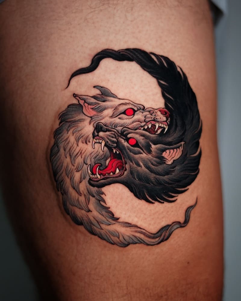 Neo-traditional two-headed wolf tattoo with red eyes for men