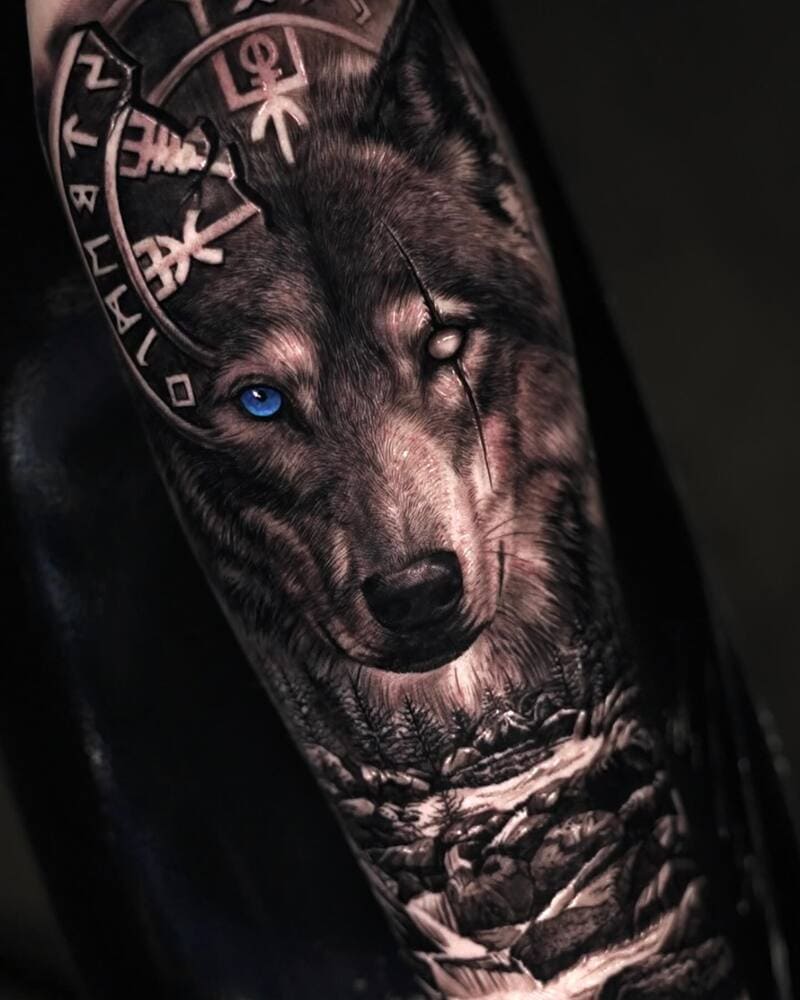 Realistic wolf sleeve tattoo with Norse elements and blue eye for men