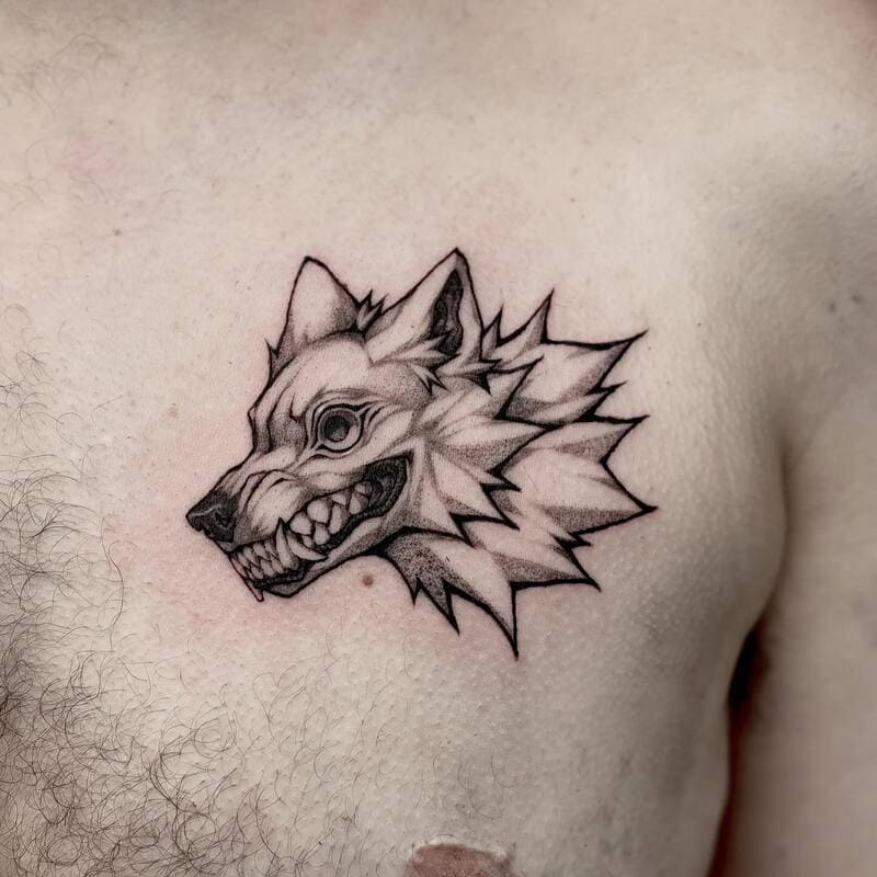 Geometric angry wolf head chest tattoo for men
