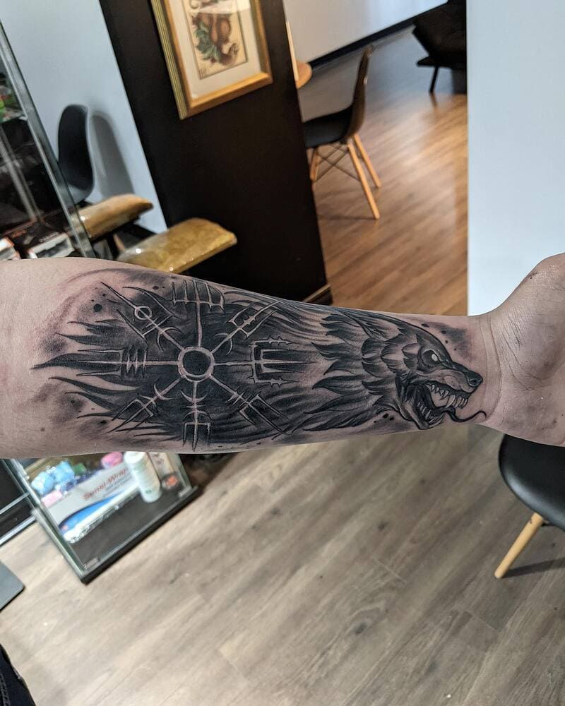 Viking wolf and Vegvisir compass forearm tattoo for men