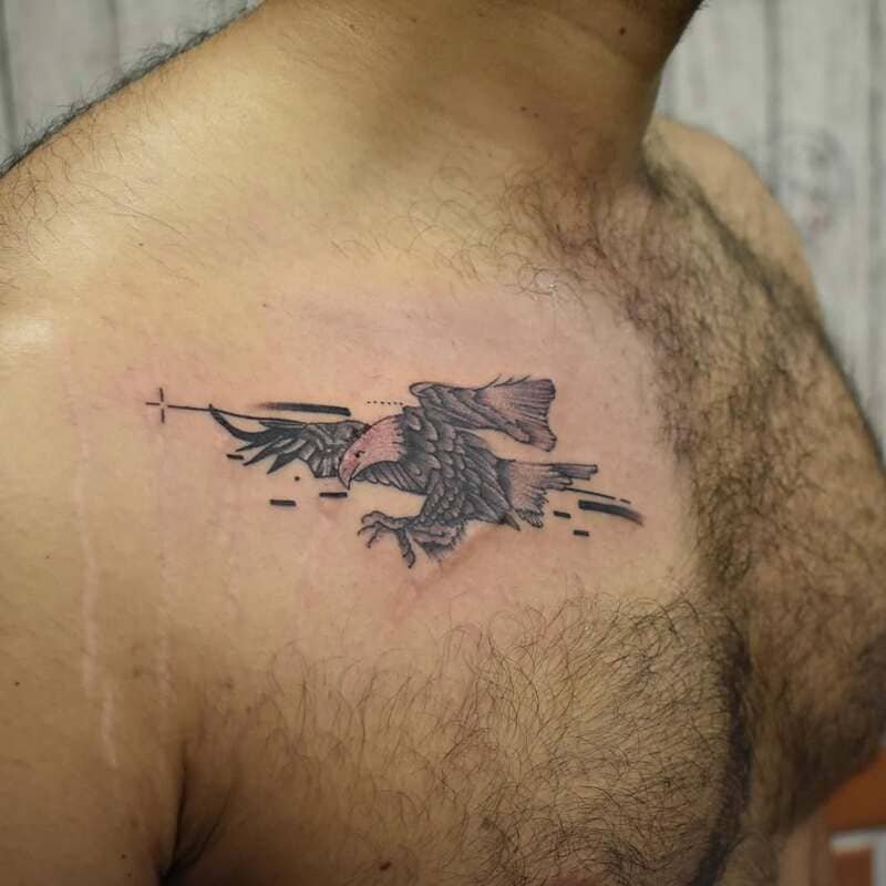 eagle-geometric-small-meaningful-chest-tattoo-men