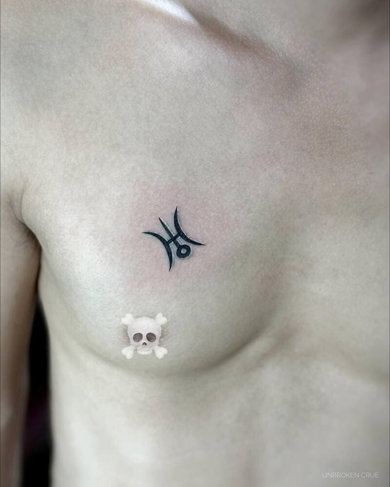 pisces-symbol-small-chest-tattoo-men