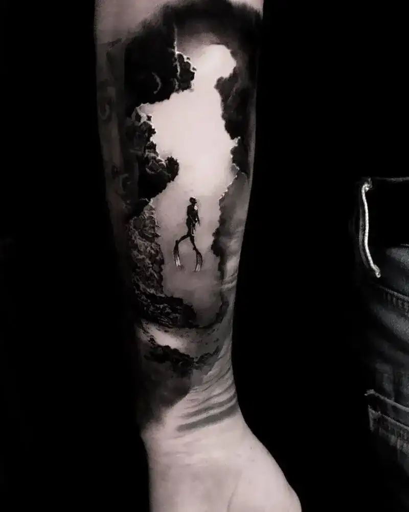 Black and gray underwater cave diver ocean tattoo for men with atmospheric shading