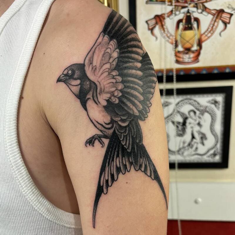 Detailed wing swallow shoulder tattoo design for men