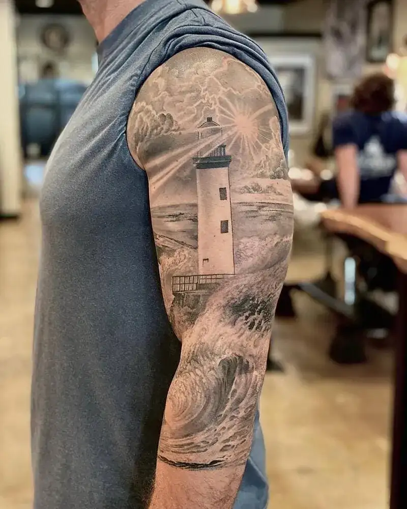 Realistic black and gray lighthouse with waves half sleeve ocean tattoo for men