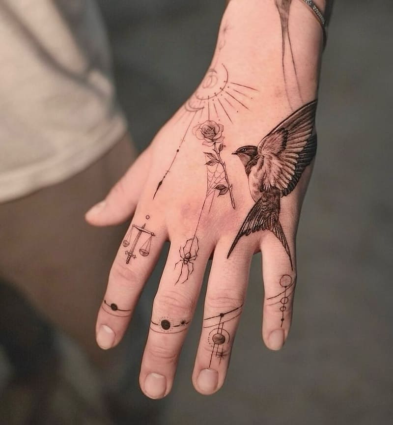 Classic swallow and lettering hand tattoo design for men