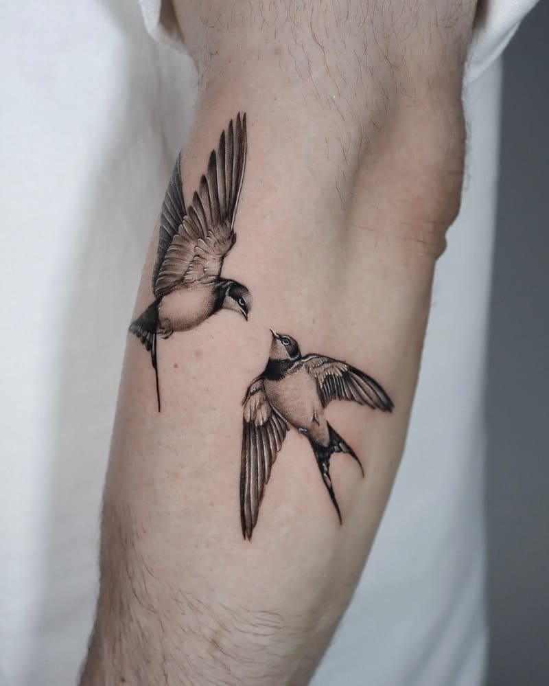 Brushstroke swallow forearm tattoo design for men