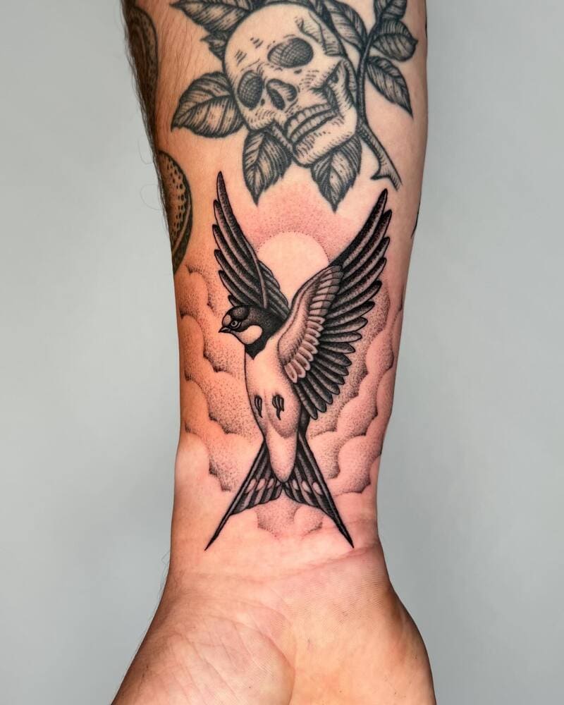 Rising swallow wrist tattoo design for men