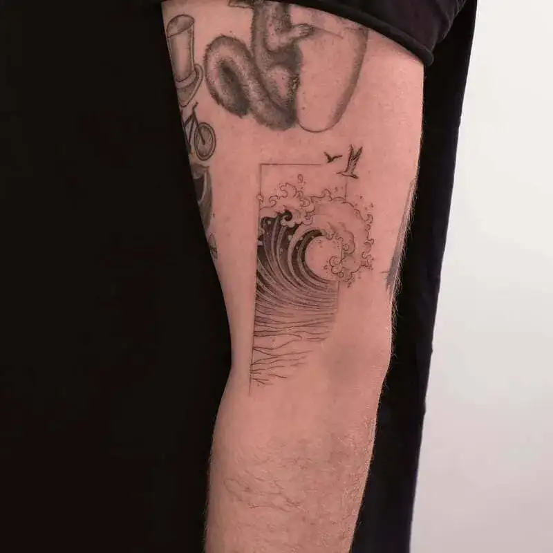 Geometric framed Japanese wave ocean tattoo for men with bird silhouettes