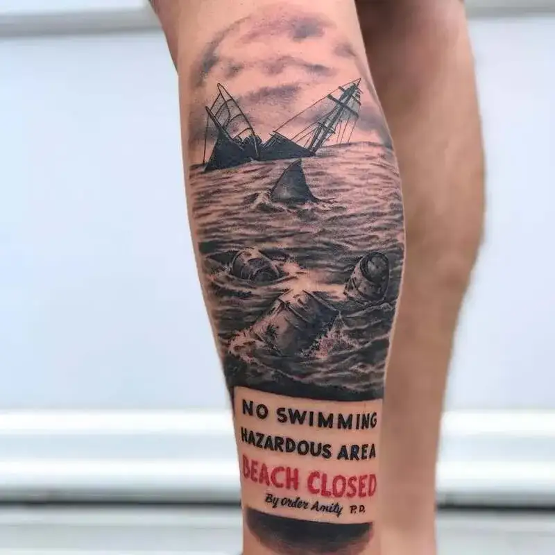 Sinking ship with shark fins realistic ocean tattoo for men with beach warning sign