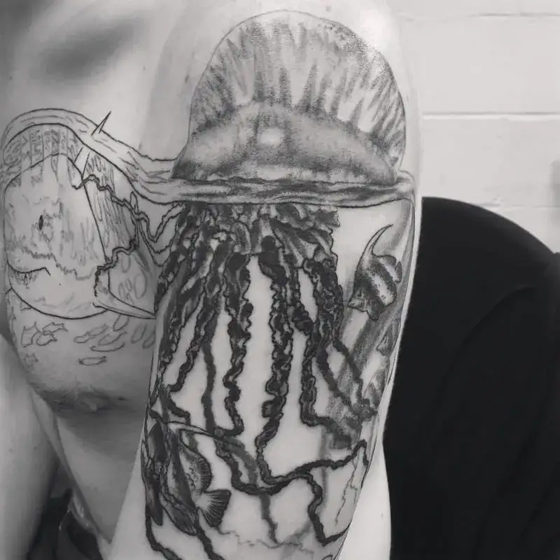 Realistic black and gray giant jellyfish ocean tattoo for men with detailed tentacles