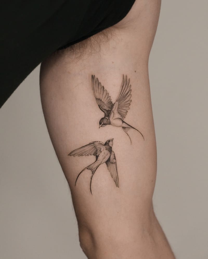 Fine line flying swallow inner arm tattoo design for men