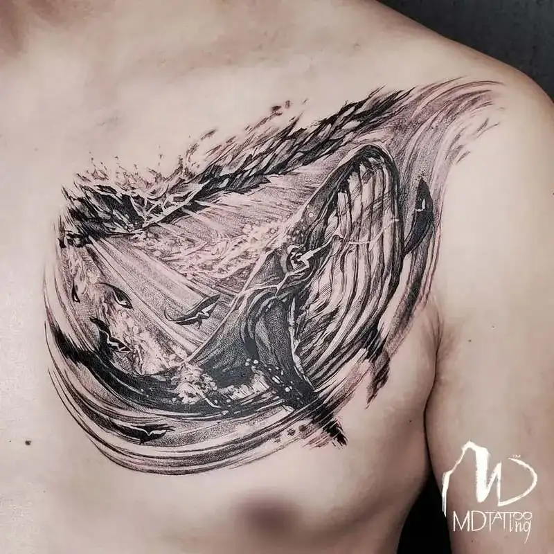 Brushstroke style whale ocean chest tattoo for men with artistic sketch technique