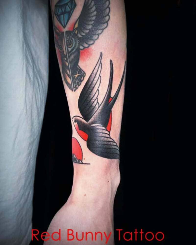 Geometric neo traditional swallow forearm tattoo design for men