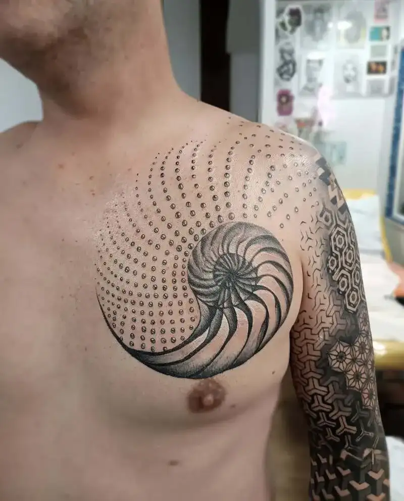 Geometric nautilus shell ocean chest tattoo for men with dotwork spiral pattern