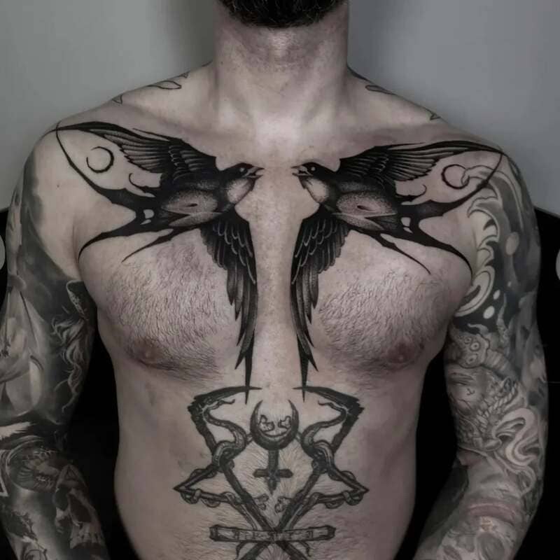 Gothic navy swallow chest tattoo design for men