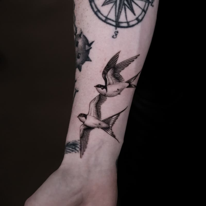 Nautical swallow wrist tattoo design for men