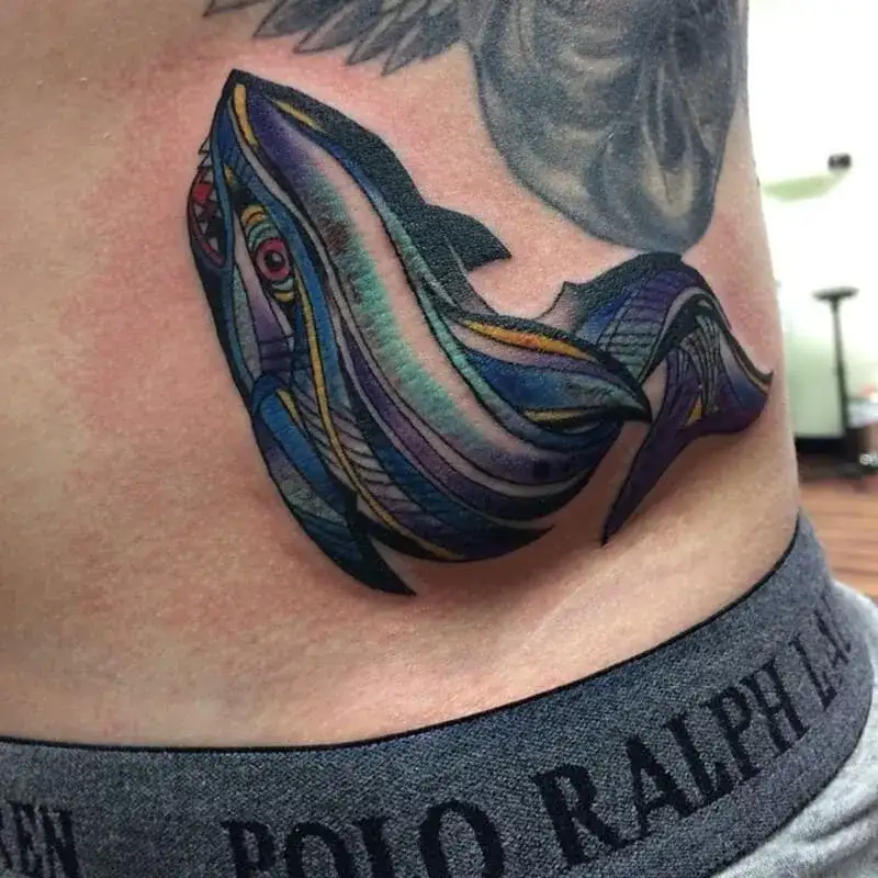 Psychedelic multicolored whale hip ocean tattoo for men with abstract patterns