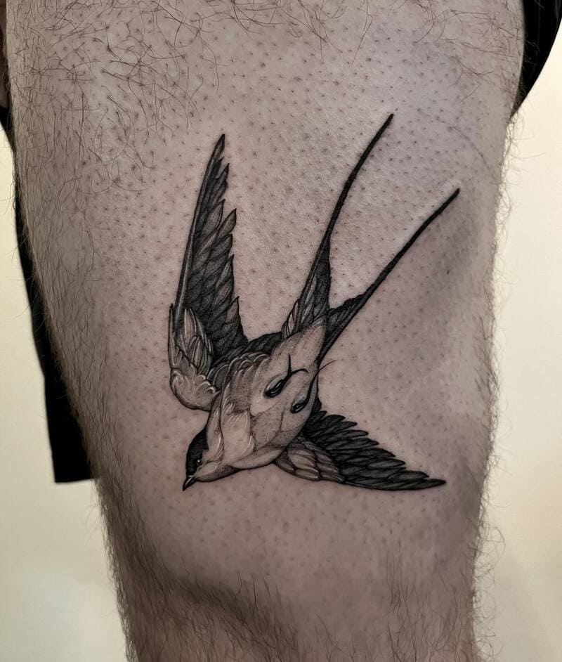 Realistic diving swallow thigh tattoo design for men